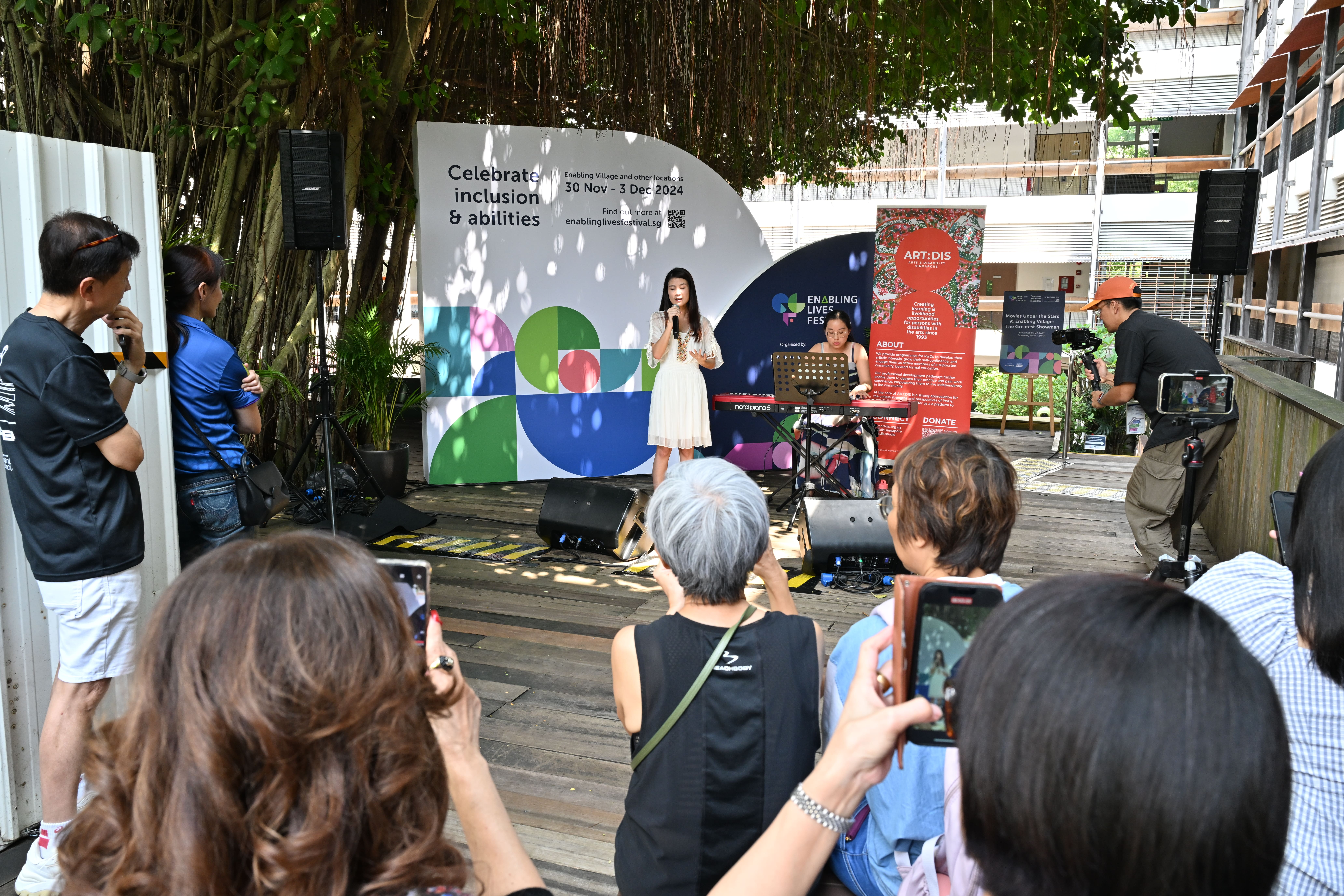 A group of people watching a performance at the Enabling Lives Festival 2024