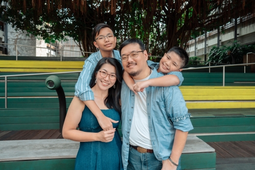 A portrait photo of a family of four.
