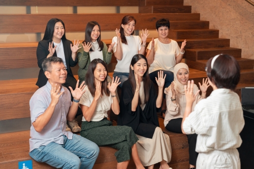 A group of participants at a sign language workshop.