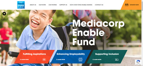 Screenshot of the Mediacorp Enable Fund homepage. A photo of a male wheelchair user, with the words "Mediacorp Enable Fund. Fulfilling Aspirations, Enhancing Employability, Supporting Inclusion."