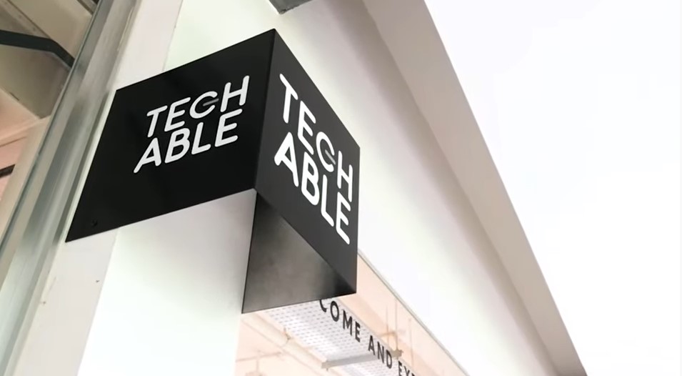 Tech Able signage perched outside the space - a white Tech Able logo against a black background.