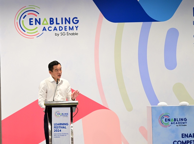 EALF Taskforce_Timeline Mr Eric Chua giving a speech at the Enabling Academy Learning Festival 2024.