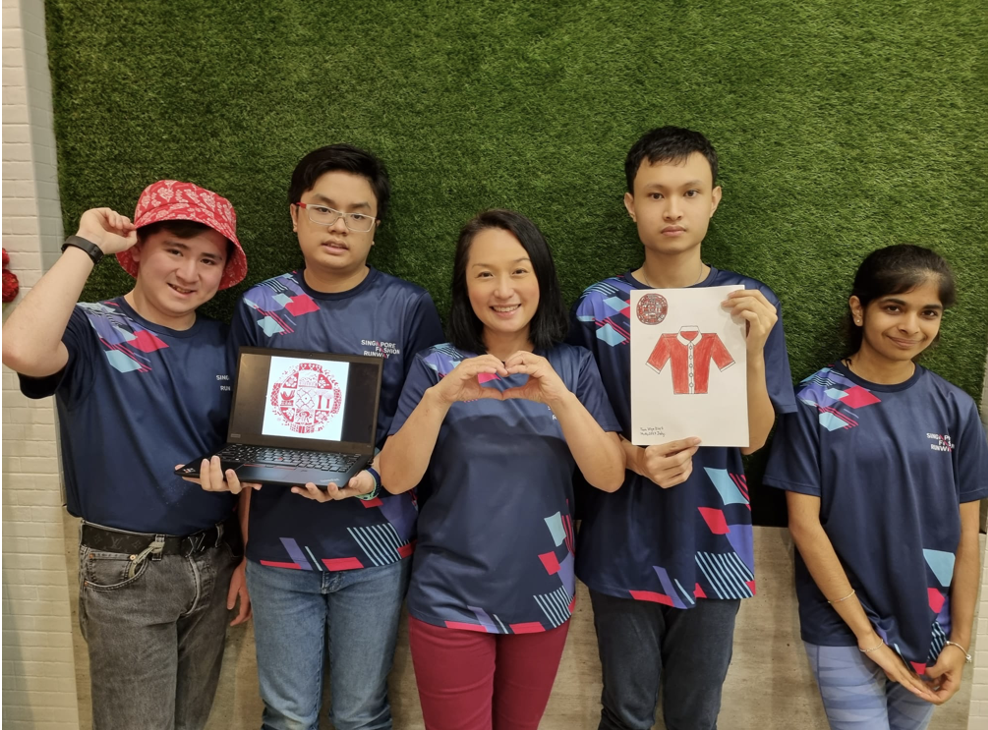 A group photo of the Singapore Fashion Runway team with their outfit design for DPM Heng Swee Keat.