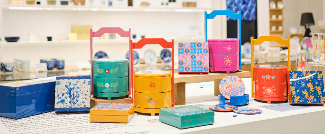 A collection of lacquerware with colourful design on display