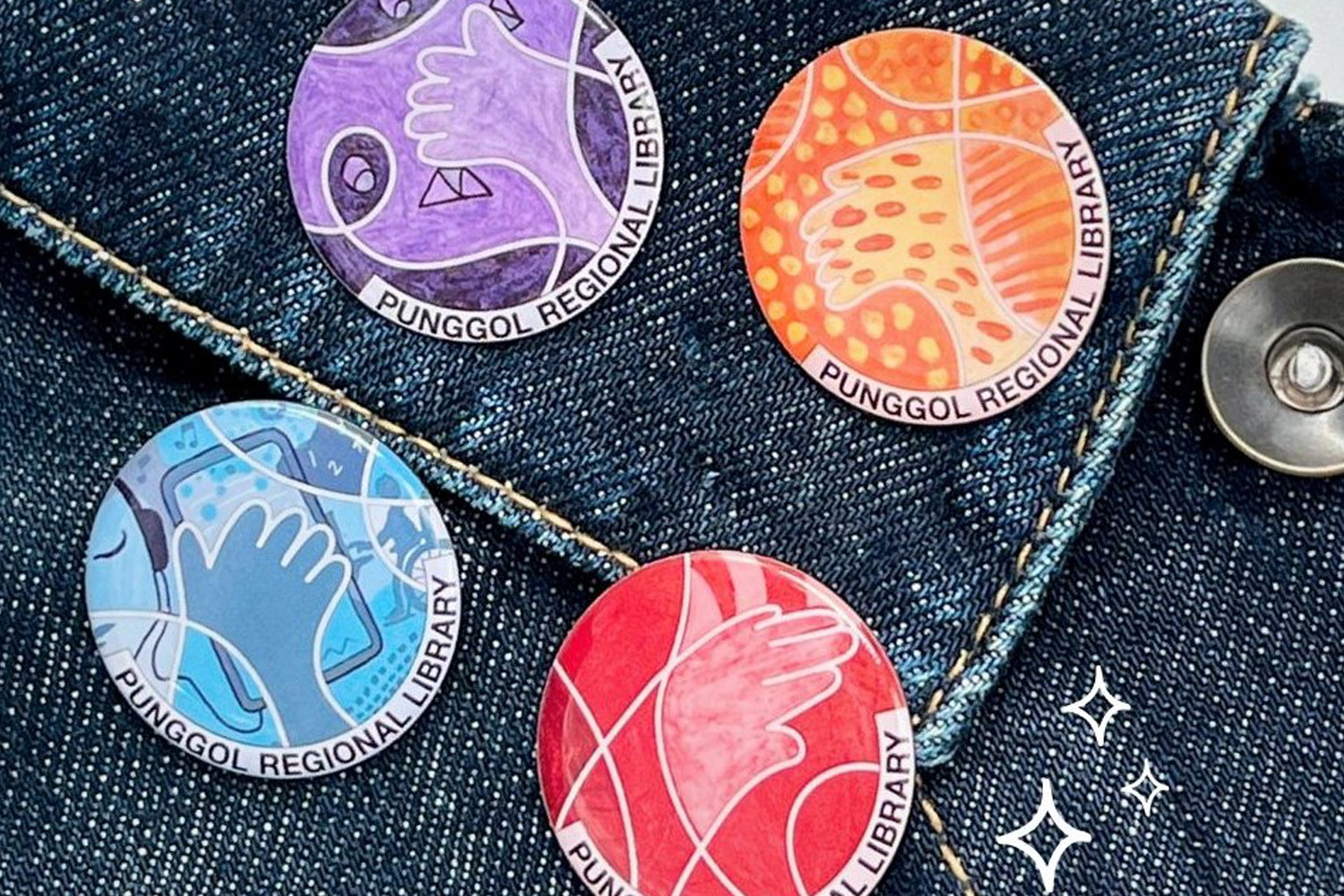 Collective pins pinned on denim fabric