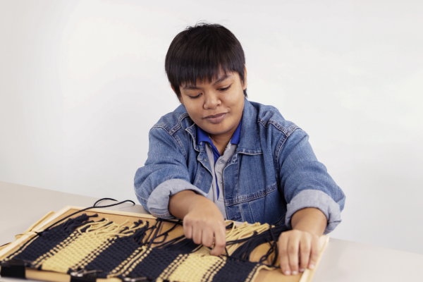 Person weaving