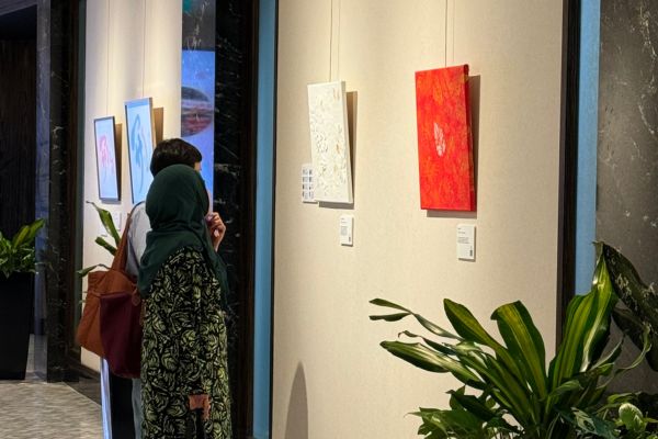 Paintings hung along a corridor