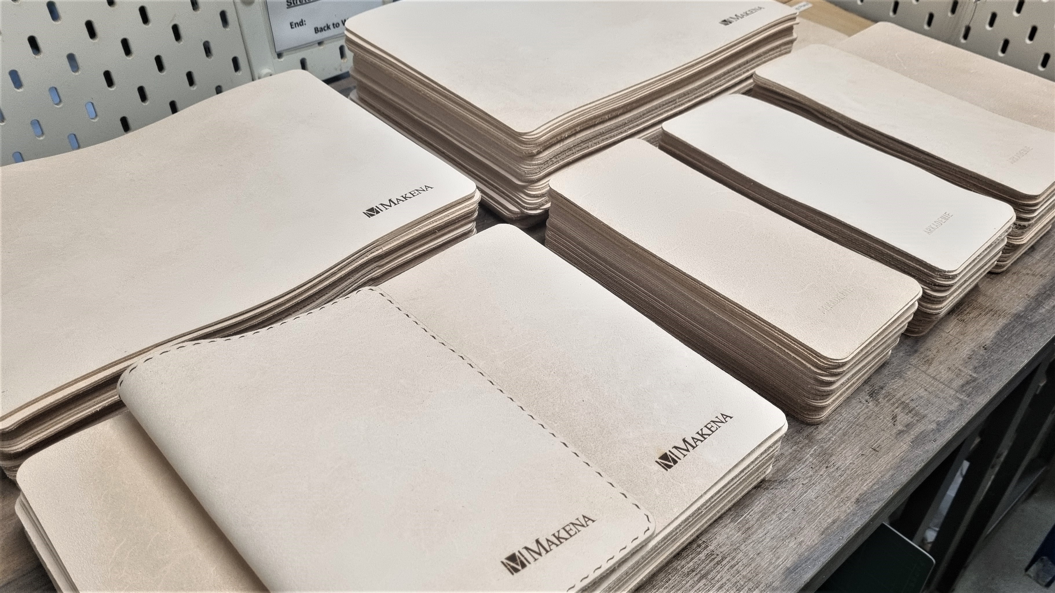 MAKENA-sleeve-06 Leather book sleeves with the Makena logo embedded at the bottom right corner of each sleeve.