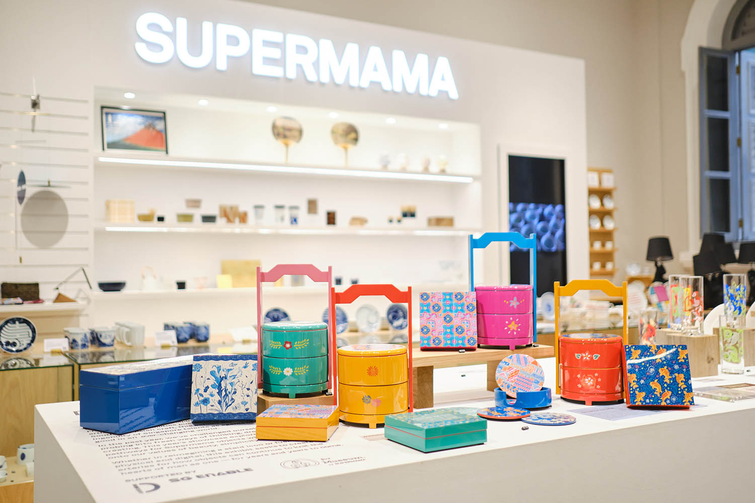 A set of lacquerware with colourful batik-inspired designs on display in a store
