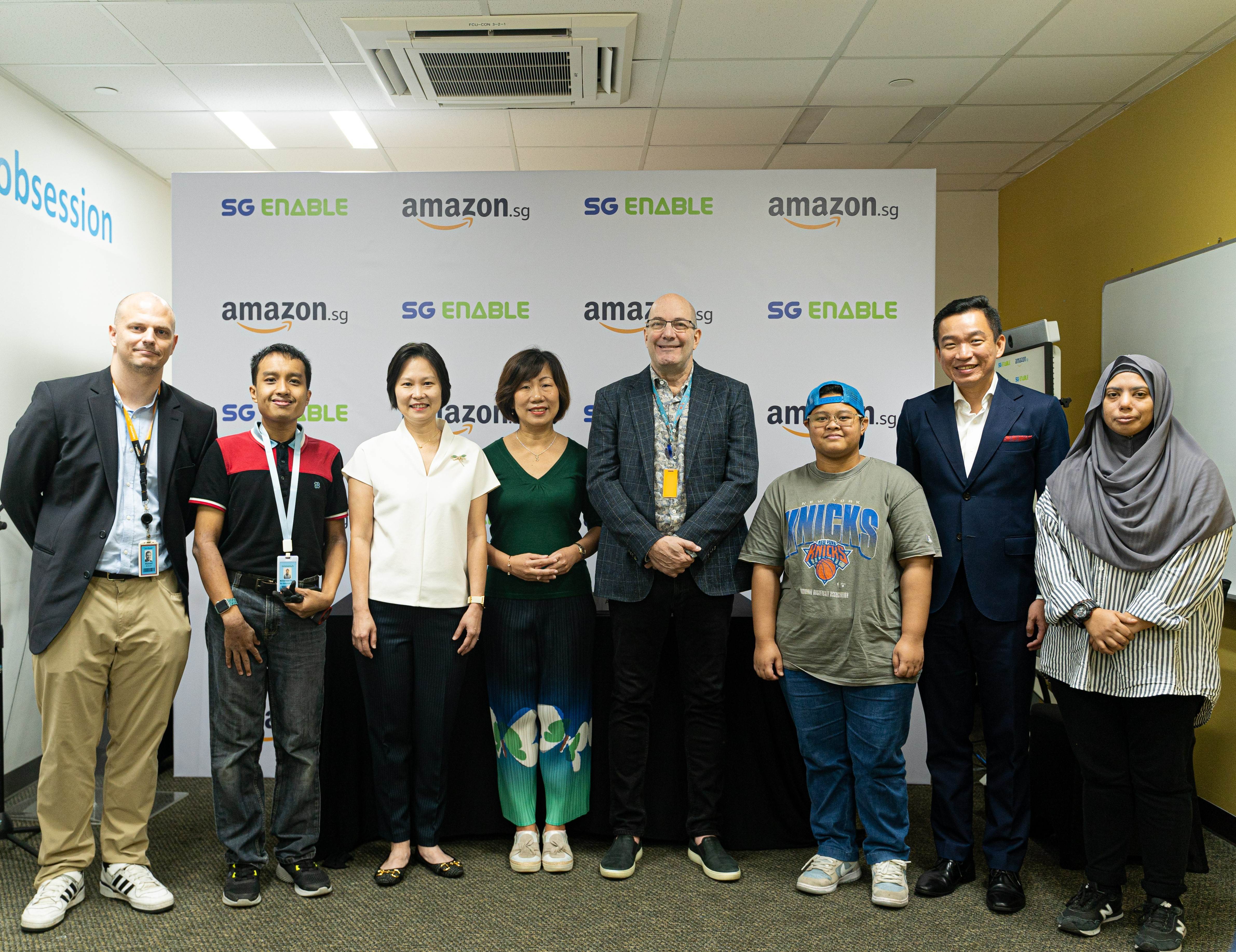  Ms. Ku Geok Boon, Mr. Steve Walter, Mr. Eric Chua and Ms. Gan Siow Huang posing with Amazon's Associates with Disabilities.
