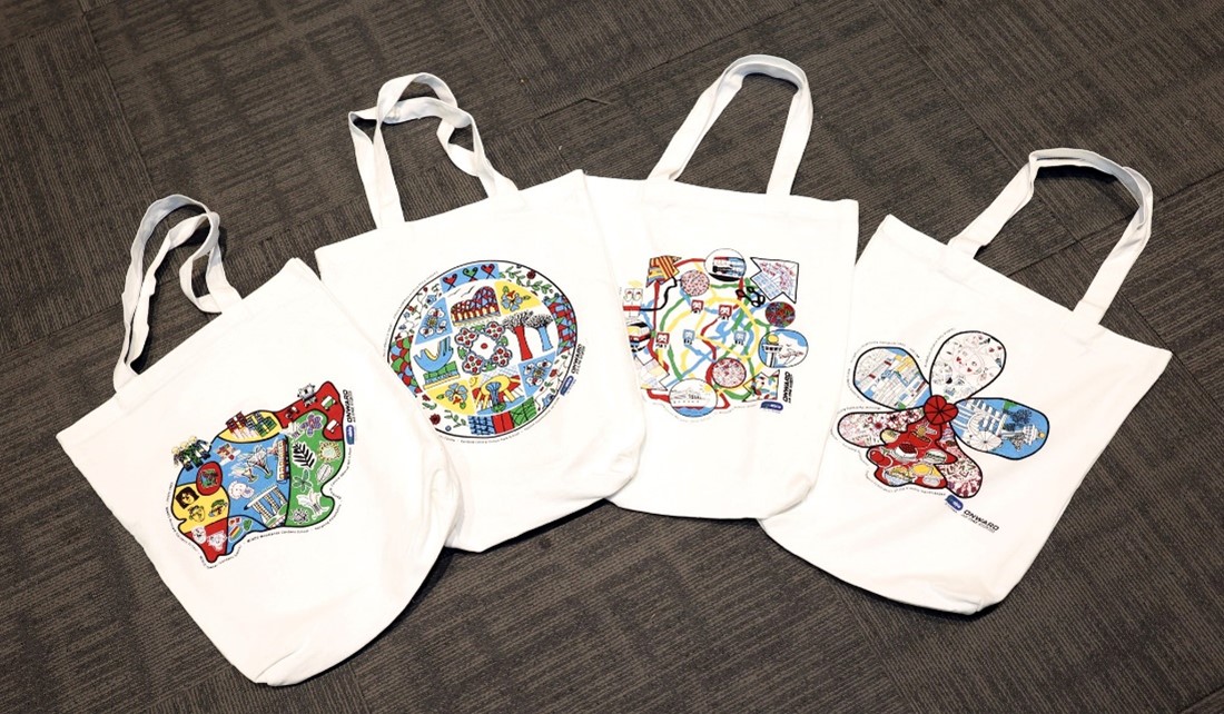 Four tote bags with designs 