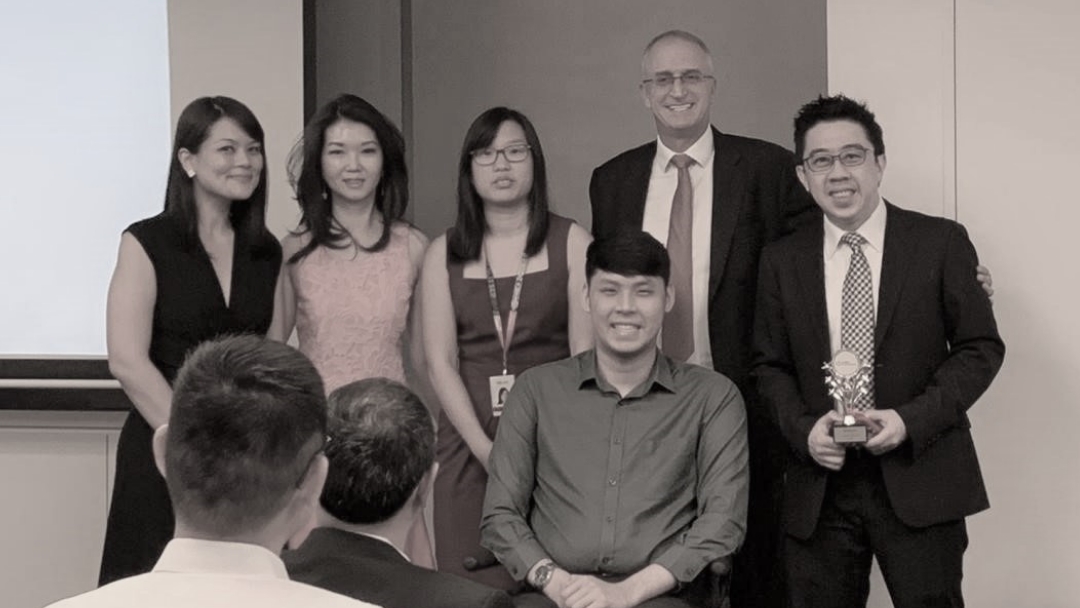 George (right) and Alwyn (3rd from right) with colleagues.