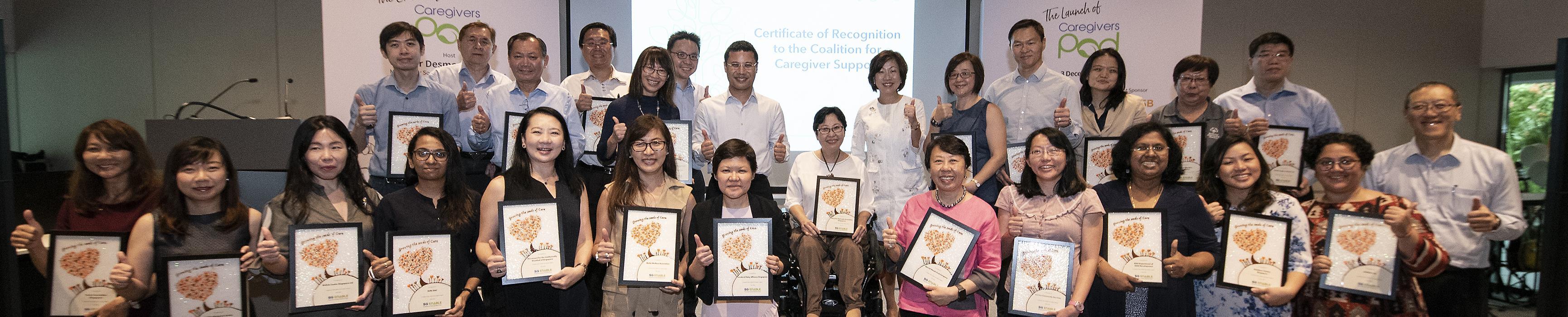 Group photo of Coalition Members with Minister Desmond Lee