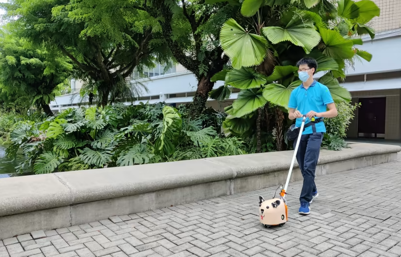 Nanyang Polytechnic student demonstrating the e-guide dog, which was funded by our Enabling Lives Initiative Grant.
