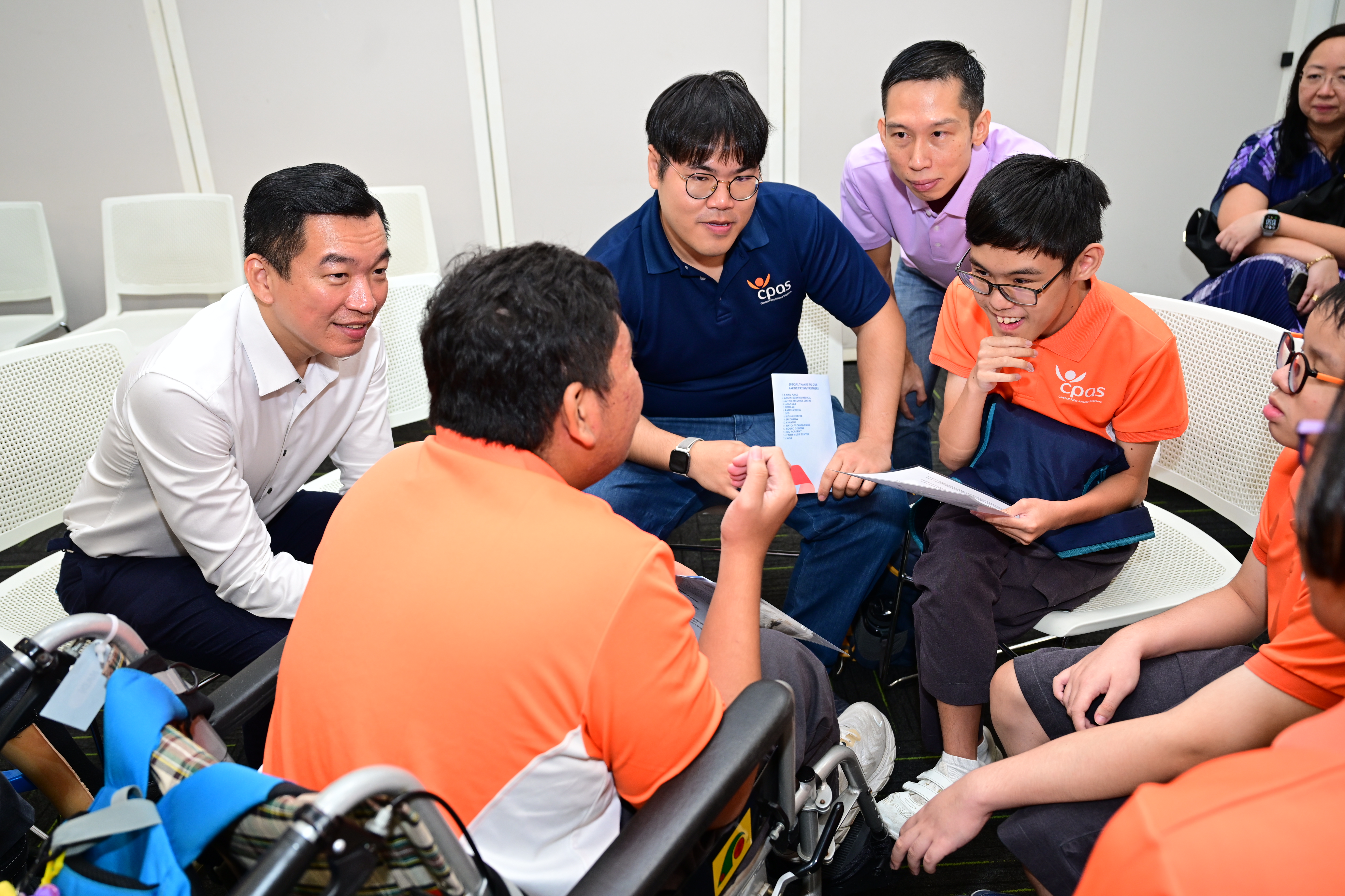 Enabling Masterplan 2030 3 Group of individuals interacting with papers in their hands