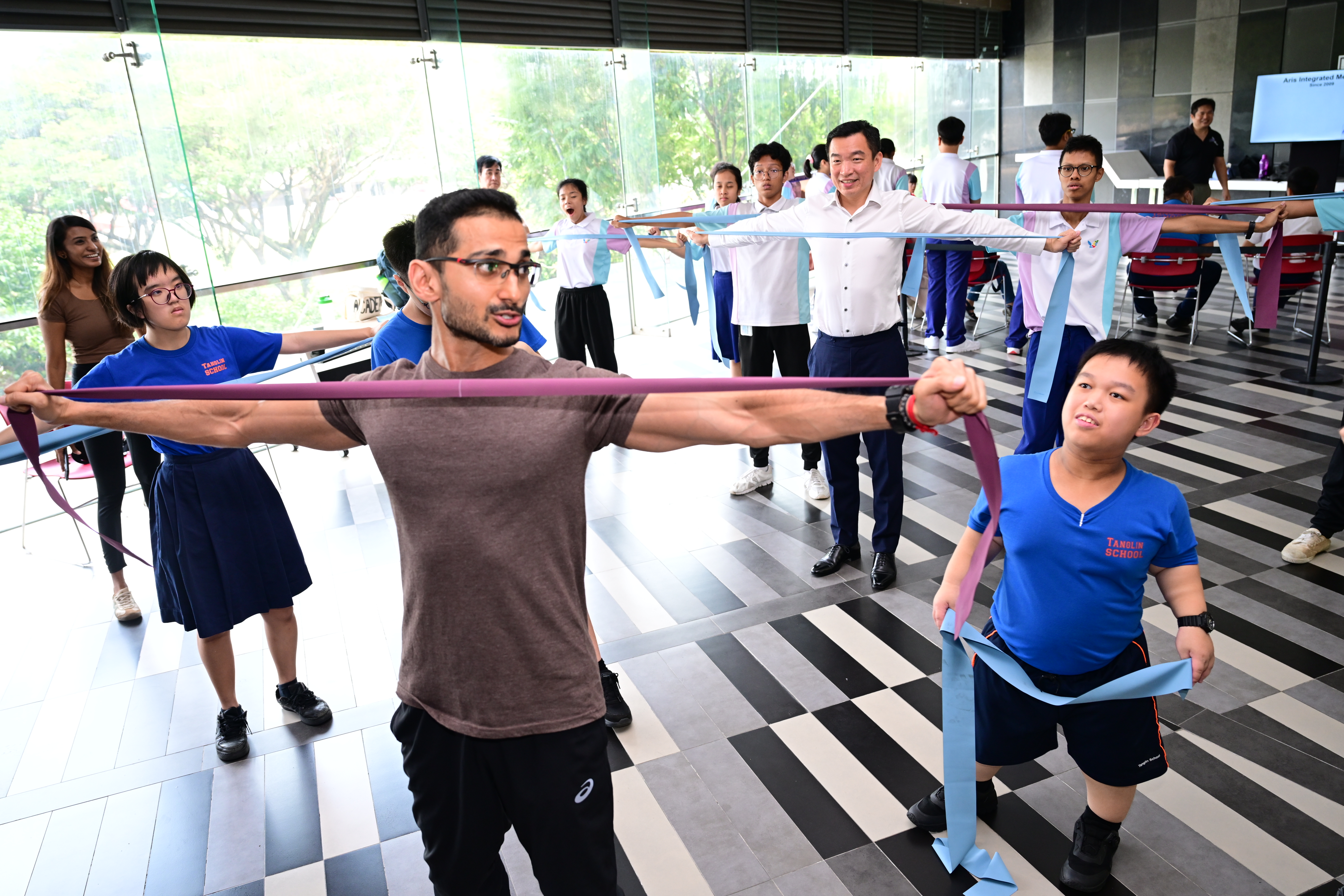 Enabling Masterplan 2030 2 Group of individuals exercising with resistance bands